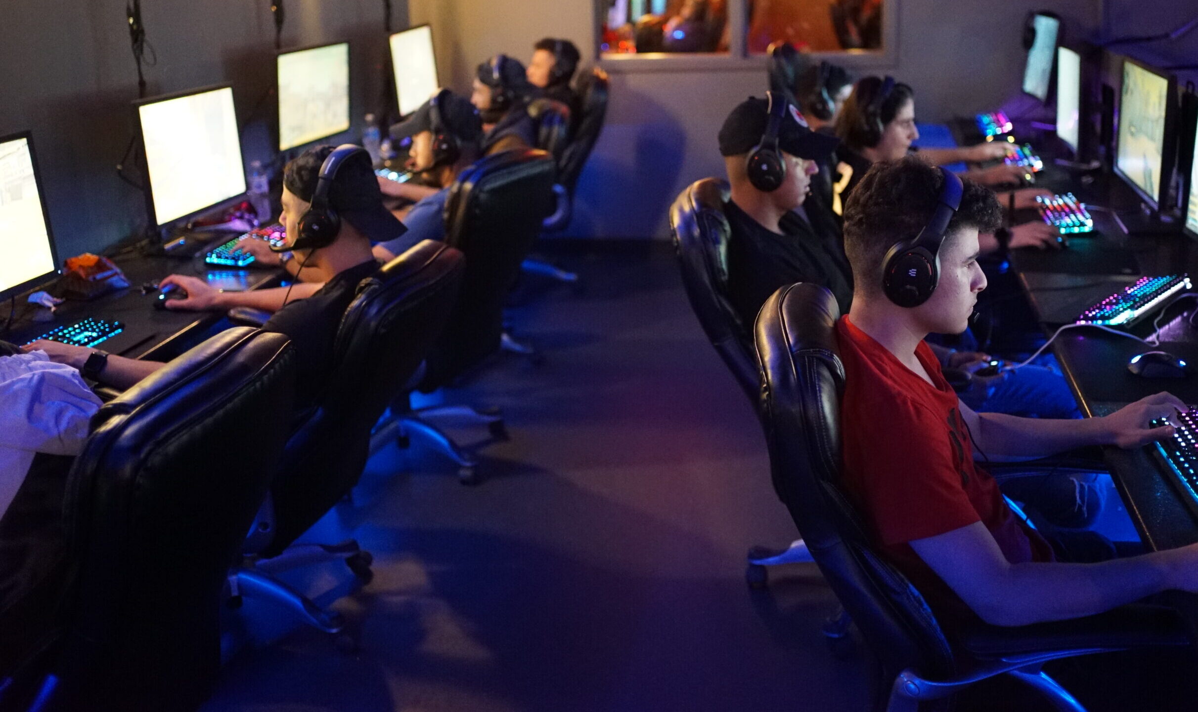 Players gaming together under RGB lighting at OverKlocked